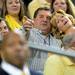 Michigan head football coach Brady Hoke points into the stands as he sits with his wife Laura during a break in the action in the first half against Ohio State at Crisler Center on Tuesday, Feb. 5. Melanie Maxwell I AnnArbor.com